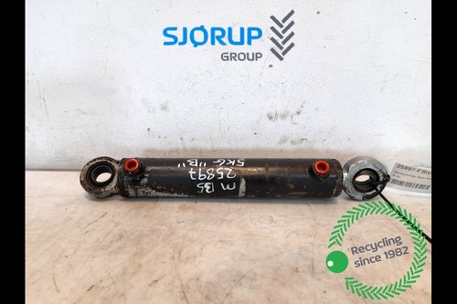 salg af New Holland M135  Front axle steering cylinder