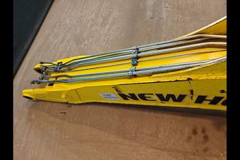 salg af New Holland B115C  Gravarm Bom