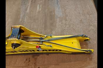 salg af New Holland B115C  Gravarm Bom