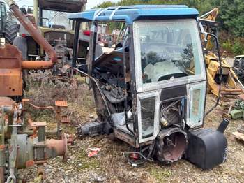 salg af New Holland TS115 traktor