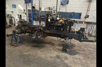 salg af New Holland TS115 traktor