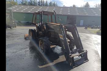 salg af New Holland TS110 traktor